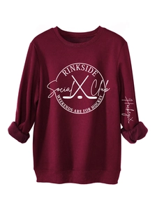 Detail of burgundy fleece sweatshirt with white hockey print and folded sleeve cuff