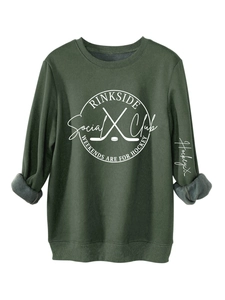 Detail of dark green hockey sweatshirt showing warm grey fleece lining and white printed logo