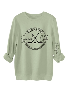 Detail of sage green crewneck sweatshirt showing ribbed collar and Rinkside Social Club print