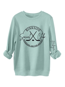 Detail of mint green sweatshirt with Rinkside Social Club hockey print and ribbed cuffs