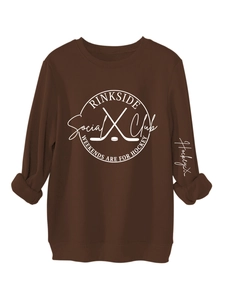Detailed view of ribbed neckline and hockey themed graphics on coffee brown sweatshirt