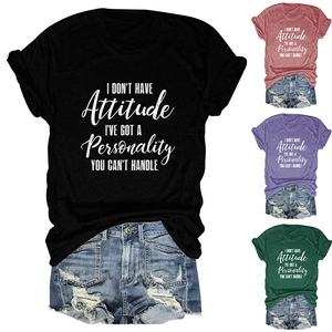 Detail view of slogan t-shirt color options including black, brick red, purple and green