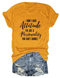 Detailed flat lay of a yellow graphic T-shirt with slogan and ripped denim shorts set
