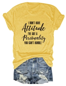 Detail of ginger yellow slogan T-shirt paired with distressed denim shorts on white background