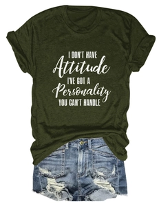 Flat lay of olive green T-shirt with personality slogan and distressed denim shorts