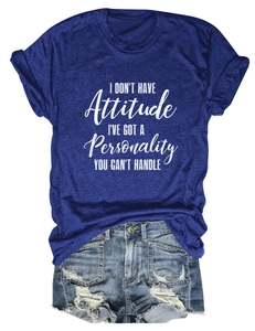 Detailed flat lay of a navy blue graphic t-shirt and distressed denim shorts
