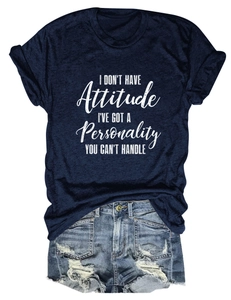 Flat lay of navy crew neck t-shirt with personality slogan and ripped denim shorts