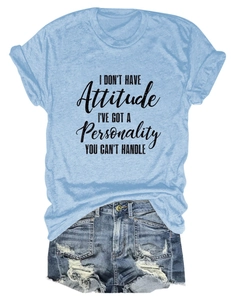 Flat lay of light blue slogan T-shirt and distressed denim shorts summer casual outfit