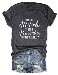 Close-up of dark grey slogan T-shirt and distressed denim shorts flat lay display