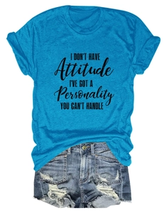 Detail of light blue cotton T-shirt with black graphic slogan and folded sleeve cuffs