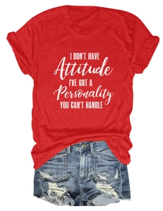 Detail of red crew neck T-shirt with white quote print and distressed denim shorts