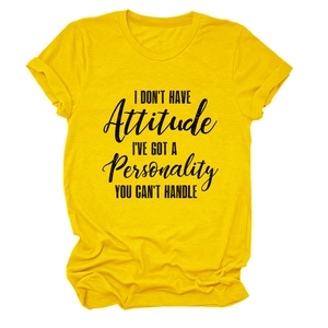 Close-up of bright yellow cotton t-shirt featuring bold black typography and rolled cuffs