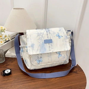 Large capacity crossbody bag with blue butterfly pattern and adjustable strap