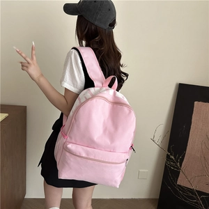Pink minimalist canvas student backpack with spacious main compartment and side mesh pockets