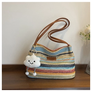 Rainbow striped straw tote bag with brown leather straps and cloud charm detail