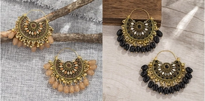 Detailed close-up of Bohemian fan-shaped earrings with amber and black beaded accents