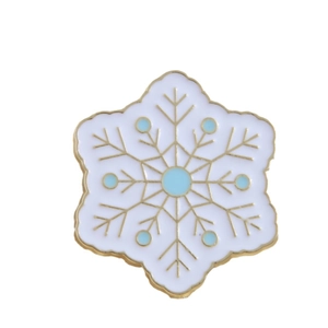 Elegant gold snowflake enamel brooch with blue and white accents for backpacks or clothing