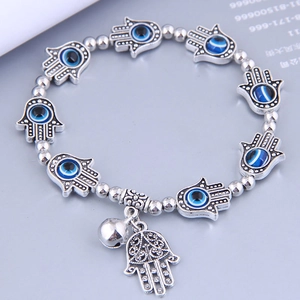 Vintage Hamsa Hand and Evil Eye beaded bracelet with luck bell and tassel charms