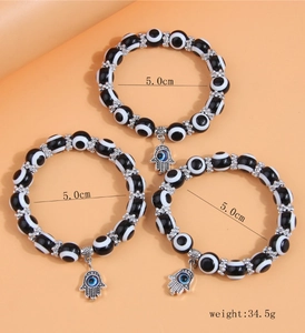 Three-layer black and white evil eye beaded bracelet set with Hamsa hand charms and 5cm inner diameter