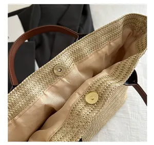 Close-up of woven tote bag showing magnetic buckle closure and durable fabric lining