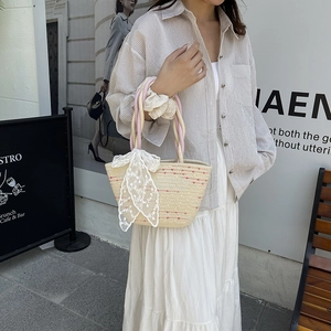 Handmade cotton rope beach tote bag with pink twisted handle and large lace bow decoration