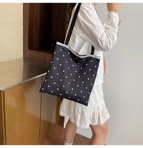 Detail of floral canvas tote with white lace trim and comfortable wide shoulder strap