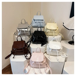 Mini PU leather backpack collection showing seven colors with drawstring and magnet closure
