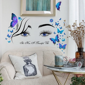 Sticker mural œil et papillon avec citation She Has A Beautiful Vibe pour la chambre