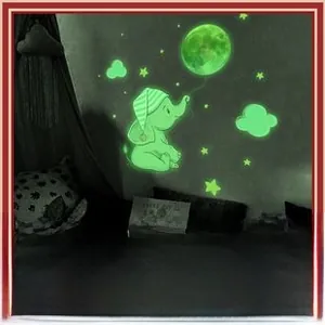 Glow-in-the-dark wall stickers featuring a cute elephant sitting on a moon with stars