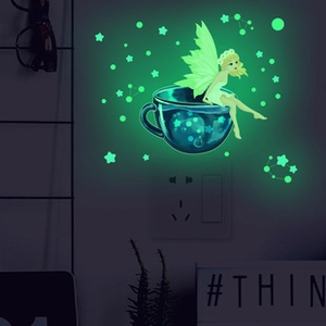 Luminous fairy sitting in a tea cup wall sticker glowing green in dark bedroom