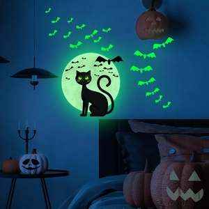 Luminous Halloween wall sticker set featuring glowing moon and bats in a dark bedroom