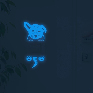 Glow-in-the-dark blue corgi dog switch sticker showing luminous effect in dark bedrooms