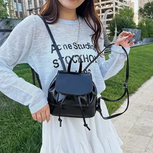 Chic black drawstring mini backpack with pleated leather texture for stylish women