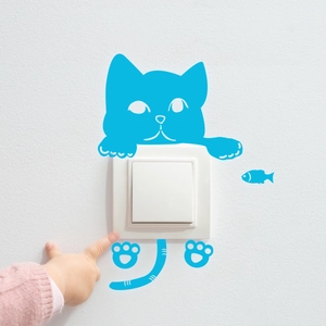 Luminous blue cat wall stickers for light switches featuring cute paw and fish elements