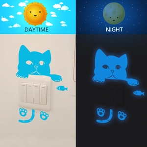 Luminous blue kitten wall sticker showing day and night glow effect on light switch