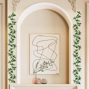 Detail van aquarel groene bladeren muurstickers gebruikt als decoratieve boogrand