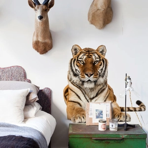 Realistic tiger head wall sticker in a modern bedroom setting with rustic furniture