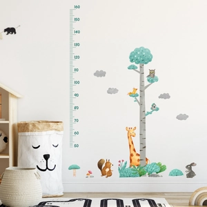 Detail of forest animals height chart wall decal showing giraffe and owl on white wall