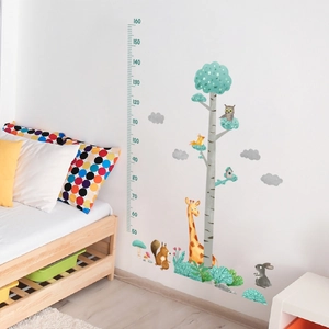 Detailed view of forest animal height chart with giraffe and owl for kids bedroom decor