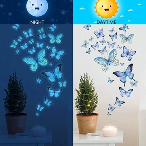 Luminous blue butterfly wall stickers showing day and night glowing effects in comparison