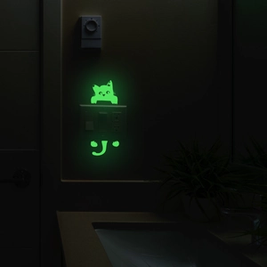 Glow-in-the-dark cat silhouette wall sticker for home light switches in green fluorescent color