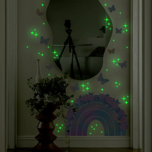 Glow-in-the-dark wall stickers featuring rainbow, stars and butterflies in a bedroom setting