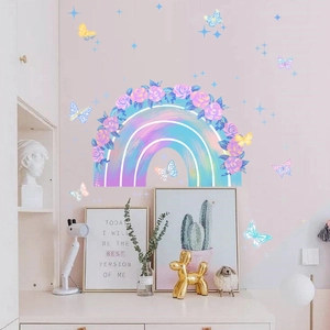 Detailed wall sticker layout featuring rainbow wreath and colorful butterflies in kid's room