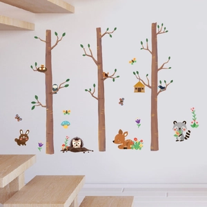 Vibrant forest animal wall stickers set with trees, owls and deer for nursery decor