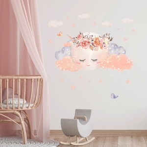 Detailed view of cartoon moon and clouds wall decals in a cozy nursery room setting