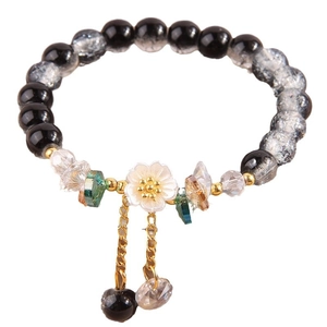 Floral beaded bracelet with white plum flower charm and layered gold chains