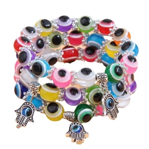 Three-layer bohemian beaded evil eye bracelets with hamsa hand charms and silver floral spacers