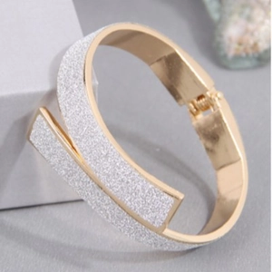 Fashionable cross-design gold metal hinge bangle with silver glitter finish for women