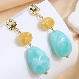 Elegant drop earrings with gold metal links and blue marble waterdrop beads
