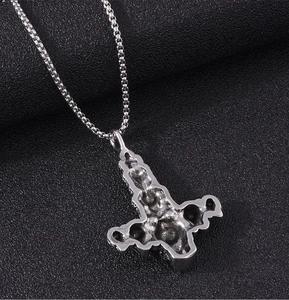 Detailed macro view of silver Thor's hammer Mjolnir pendant back on a box chain